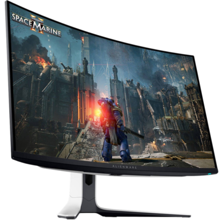 Curved Alienware monitor displaying a Warhammer 40K game scene with a Space Marine in a ruined city battlefield