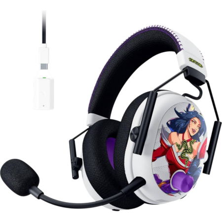 White over-ear gaming headset with purple stitching, a microphone boom, and a cartoon character decal on the ear cup against a black background.