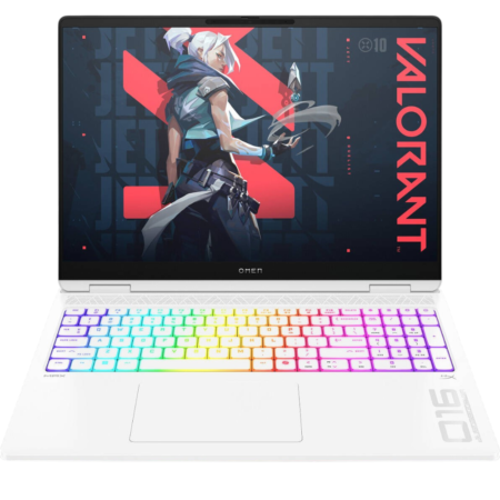 White gaming laptop with RGB-lit keyboard and Valorant wallpaper on screen, showing OMEN branding on the deck.