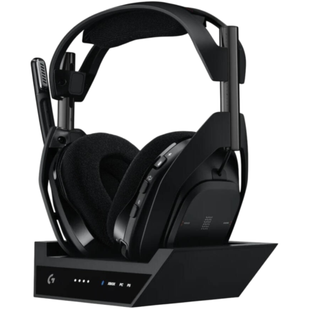 Black wireless gaming headset resting on a charging dock with LED status lights on the base